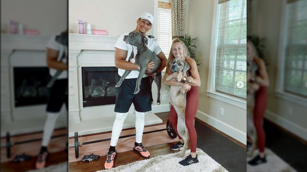 Patrick Mahomes with his girlfriend and dogs