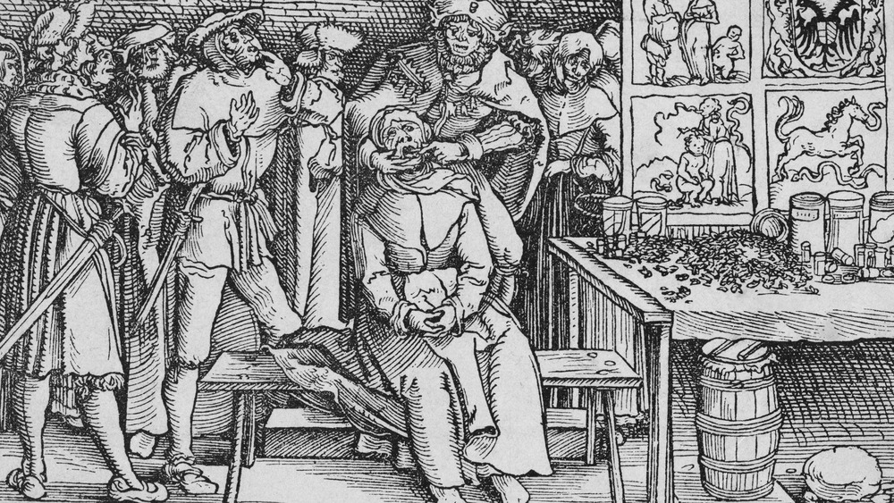 medieval woodcut of a dentist