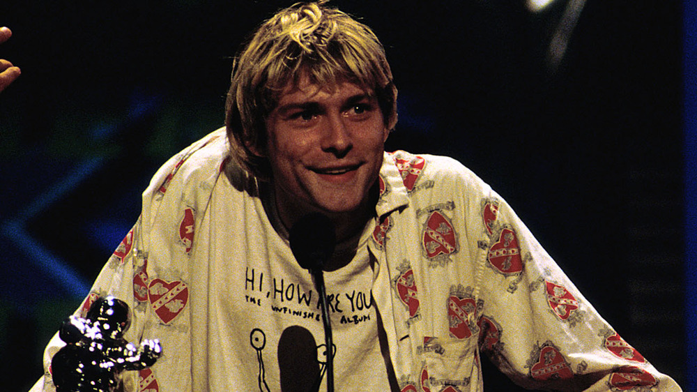 Kurt Cobain smiling near microphone