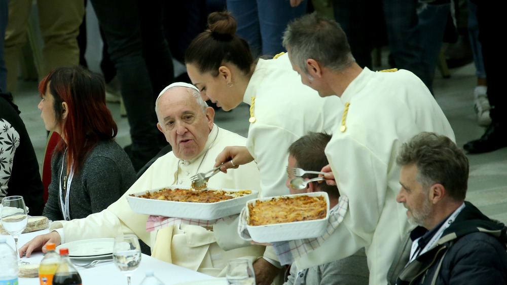 Waiters serving lunch to Pope Francis