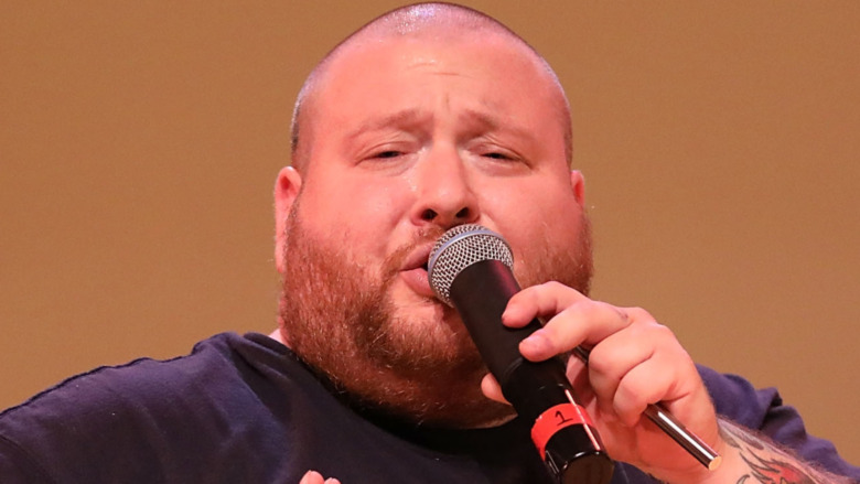 Action Bronson rapping in microphone