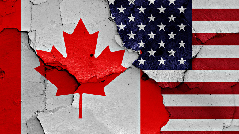 Broken US and Canadian flags