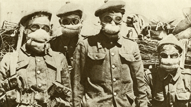 Soldiers wearing gas masks