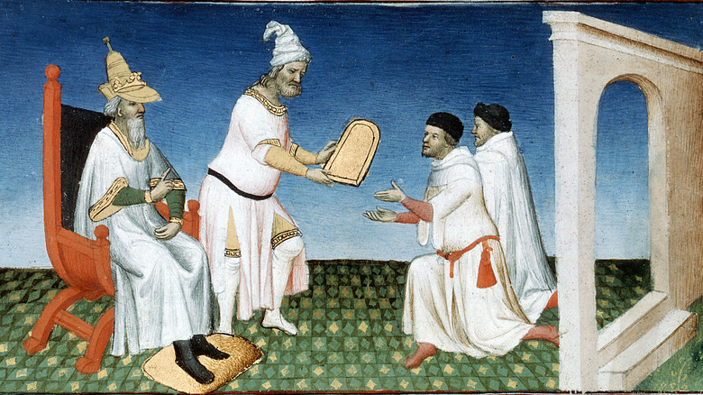 Kublai Kahn giving the Polos their passports