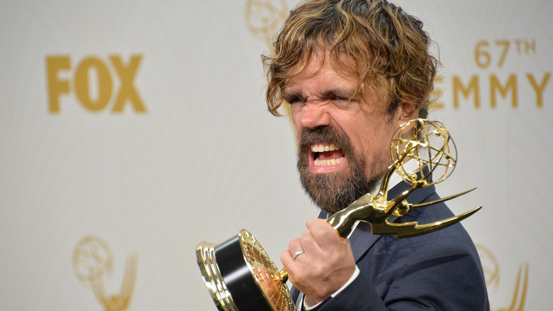 Peter Dinklage poses with award