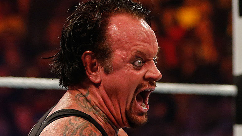 The Undertaker laughing evilly