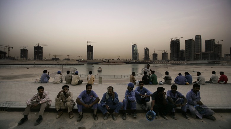 Dubai laborers resting