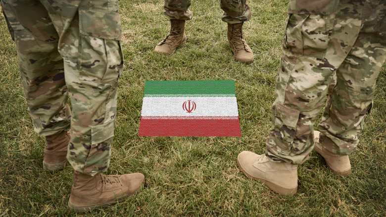 Iranian Revolutionary Guards around flag