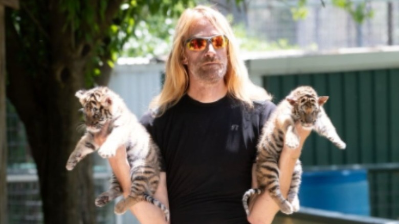 Erik Cowie and two tiger kittens
